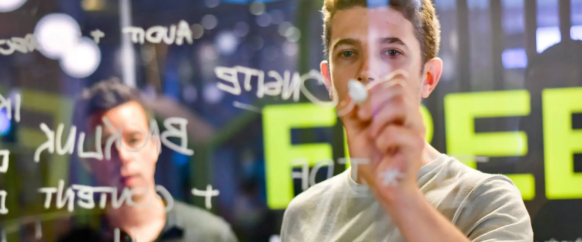 Business plan being drawn on a glass board Business plan being drawn on a glass board