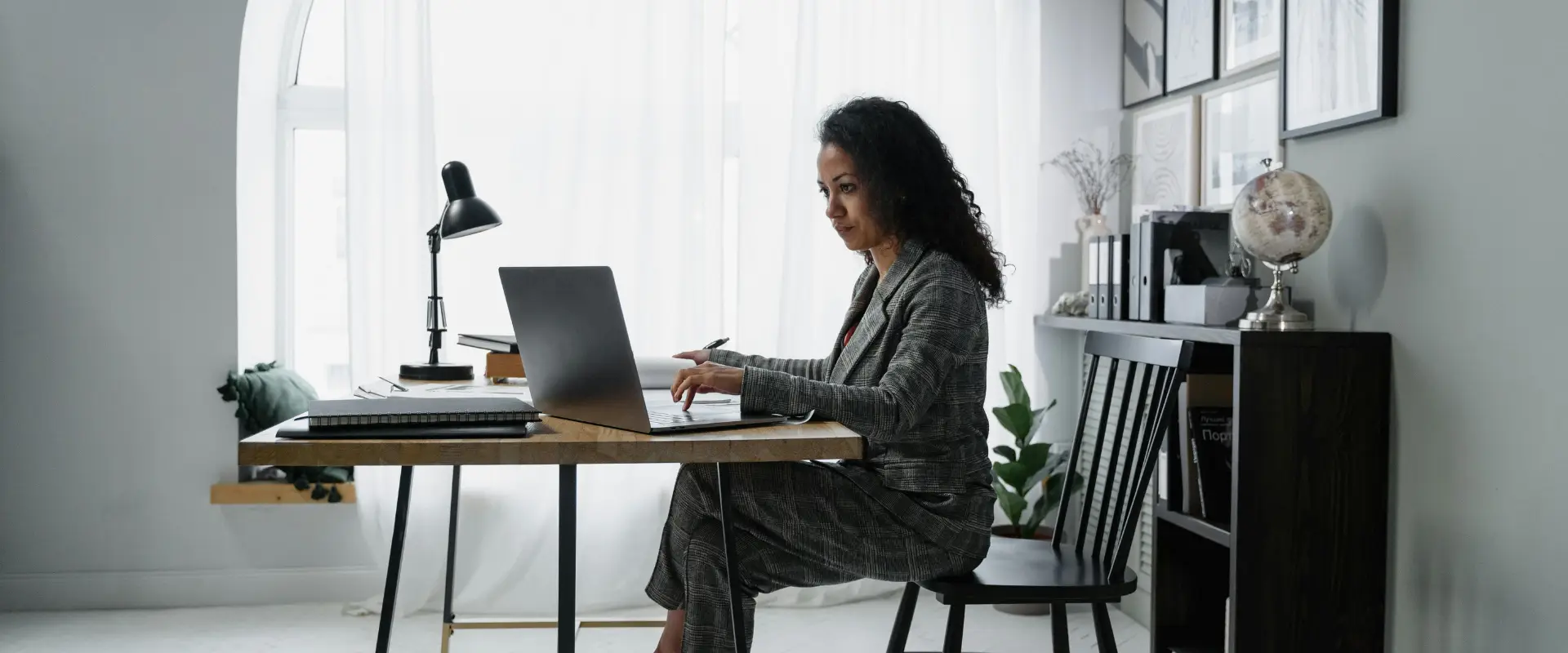 Woman dressed in suit doing self assessment in an office